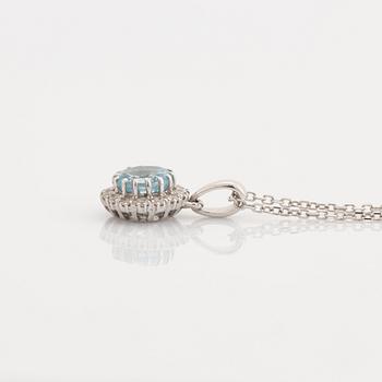 Blue topaz and brilliant cut diamond earrings and necklace.