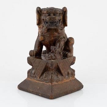 A wooden sculpture of a buddhist lion, 19th Century.