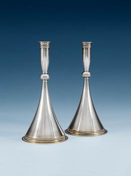 661. Wiwen Nilsson, A pair of Wiwen NIlsson sterling candle sticks, Lund 1954.