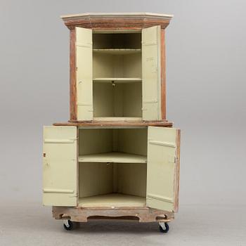 A first half of the 20th century corner cabinet.