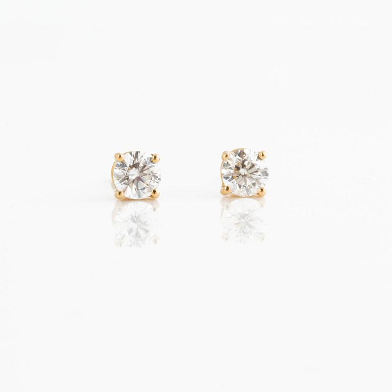 A pair of brilliant-cut diamond earrings. Total carat weight ca 0.60 cts.