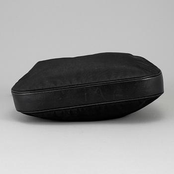 GUCCI, a canvas handbag.