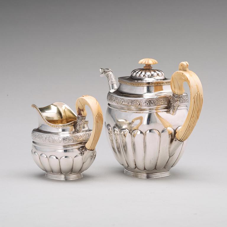 A Russian 19th century parcel-gilt silver coffeepot and cream jug, mark of Gustav Lindgren, St Petersburg 1827.