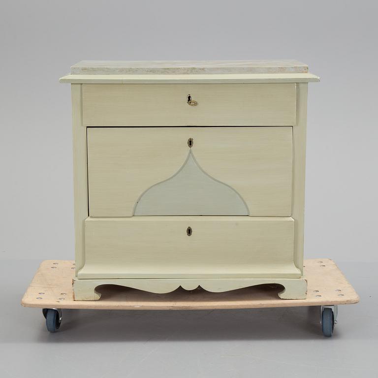 A mid 19th century painted chest of drawers.