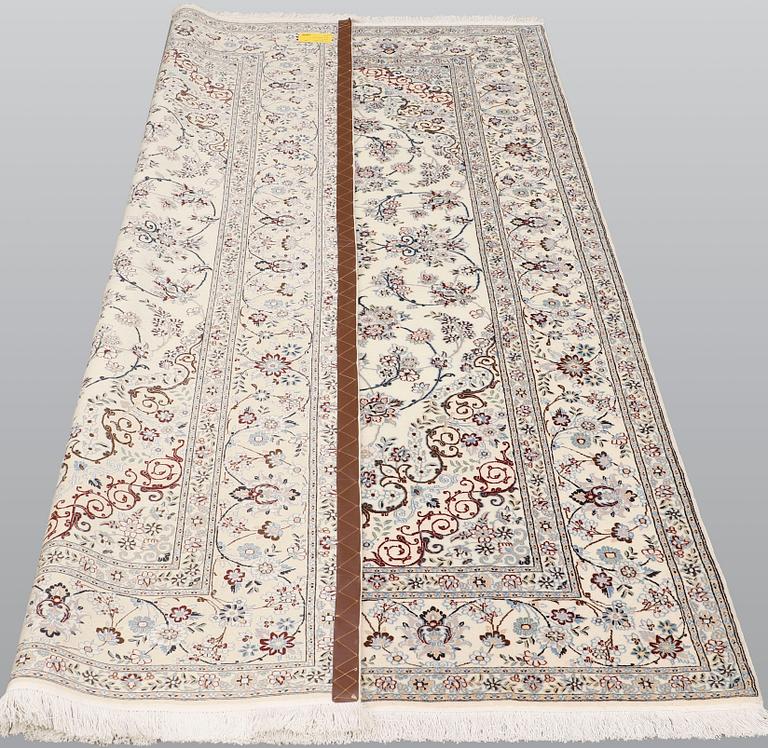 A Nain part silk carpet, 244 x 156 cm.