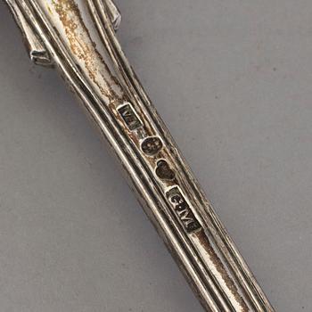 Four Swedish 19th-/20th century parcel-gilt caster-spoons and a sauce-spoon.
