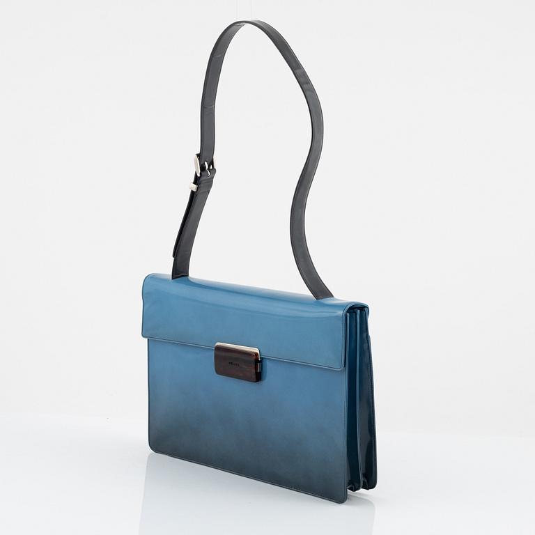 Prada, a blue patent leather bag.