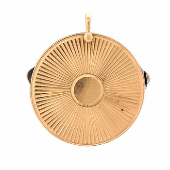 A 14K gold and steel medallion with knives.