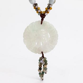 A collier with jade and nyon cord.