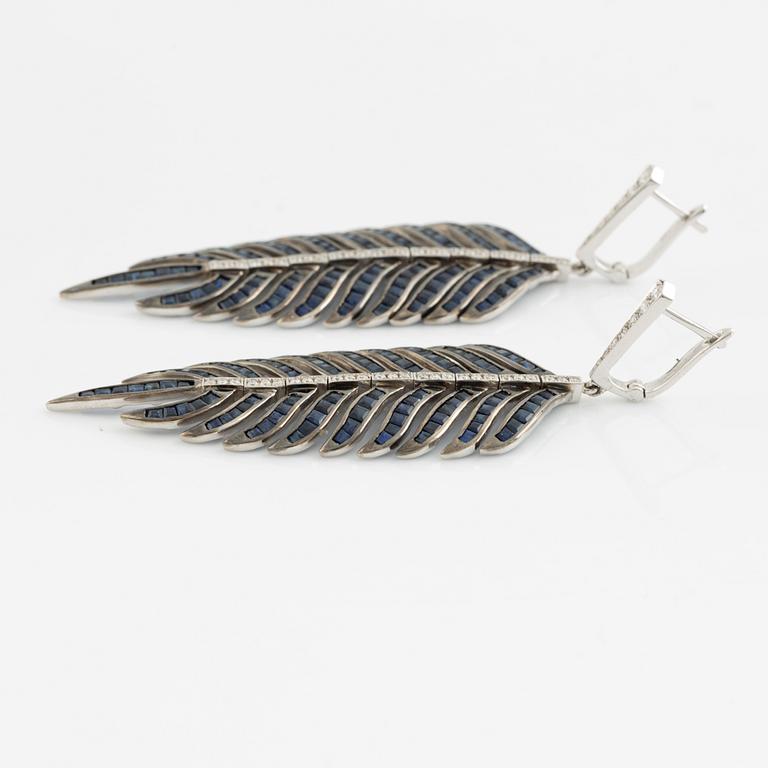 Sapphire and brilliant cut diamond feather earrings.