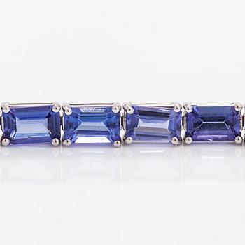 A 14K white gold bracelet with tanzanites. With Gemological center certificate.
