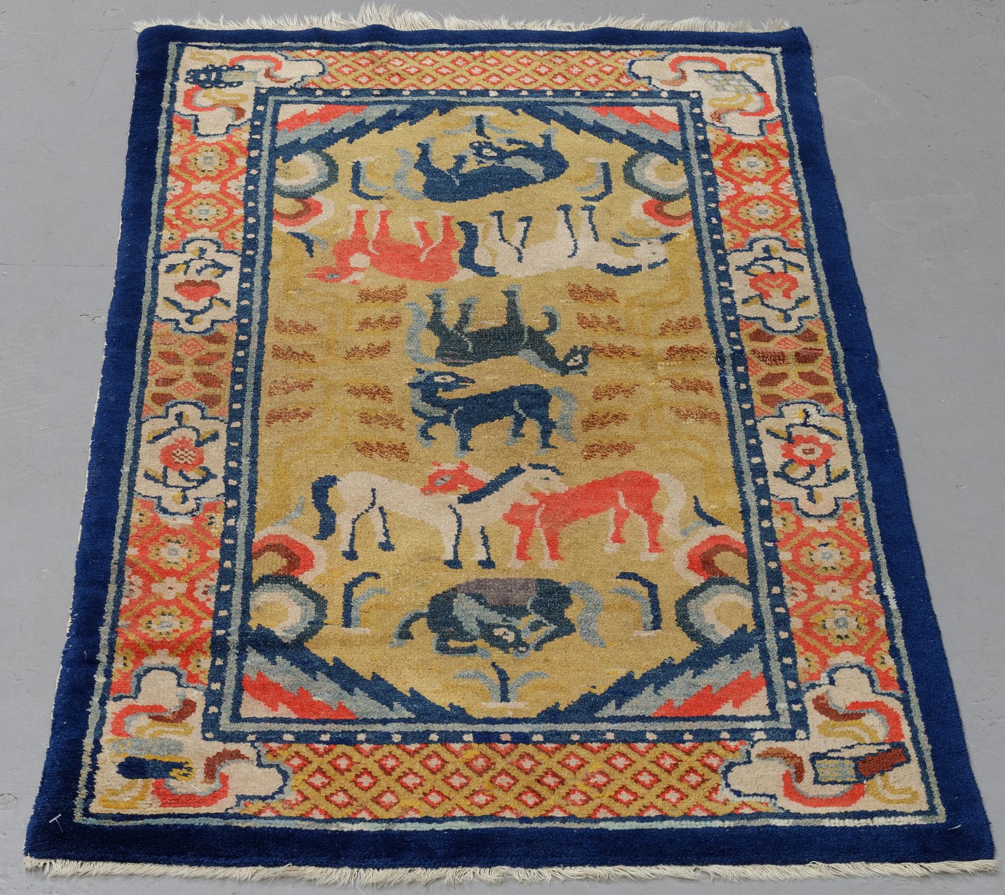 A semi-antique chinese Baotou rug, ca 147,5 x 72 cm.