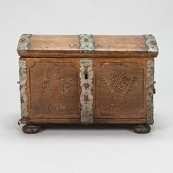 An oak wood chest dated 1710.