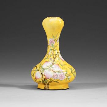 A yellow enamel on copper vase, Qing dynasty (1644-1912), with Qianlong four character mark.