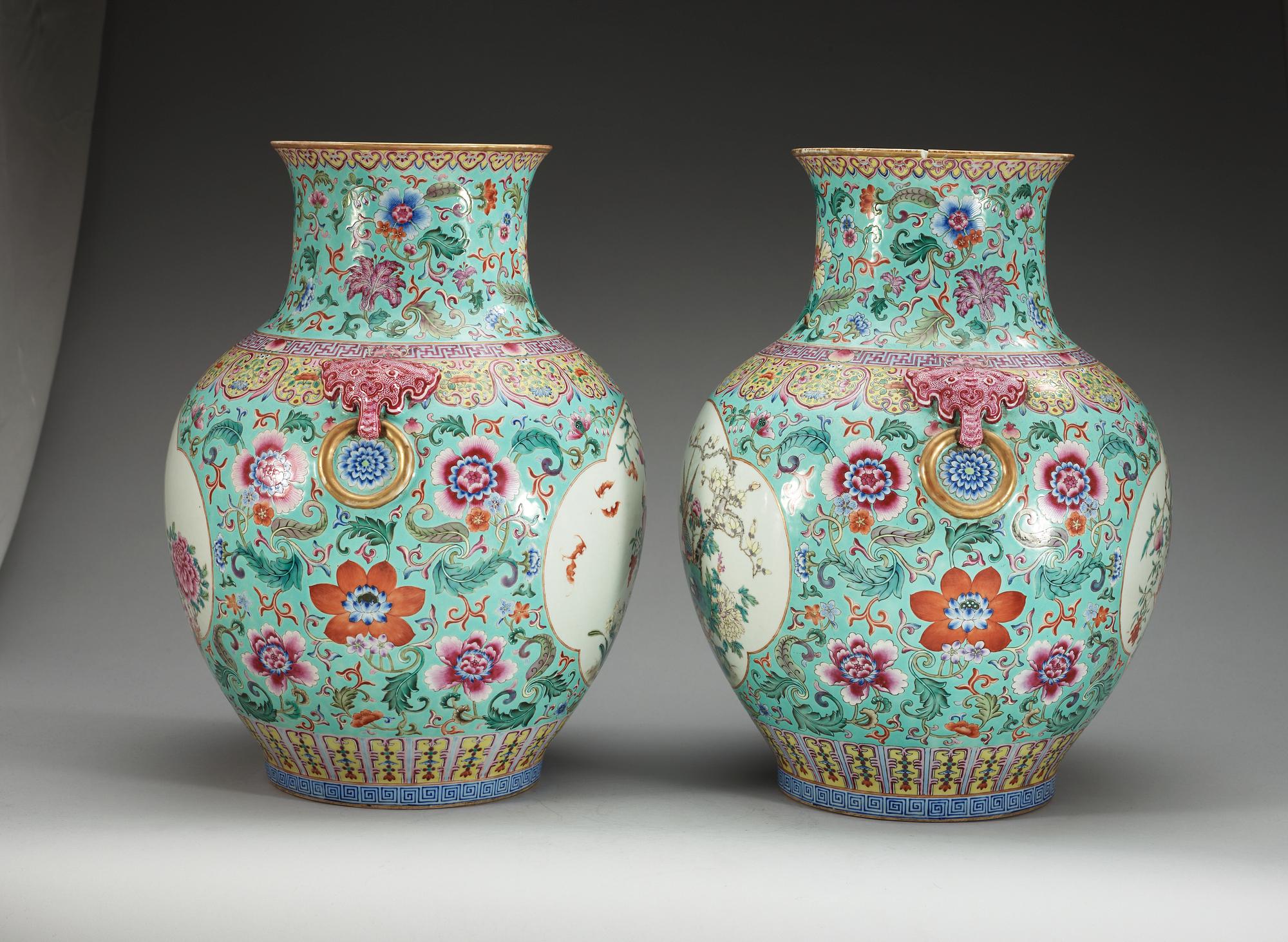 A large pair of turquoise ground famille rose vases, early 20th Century with Qianlongs sealmark.