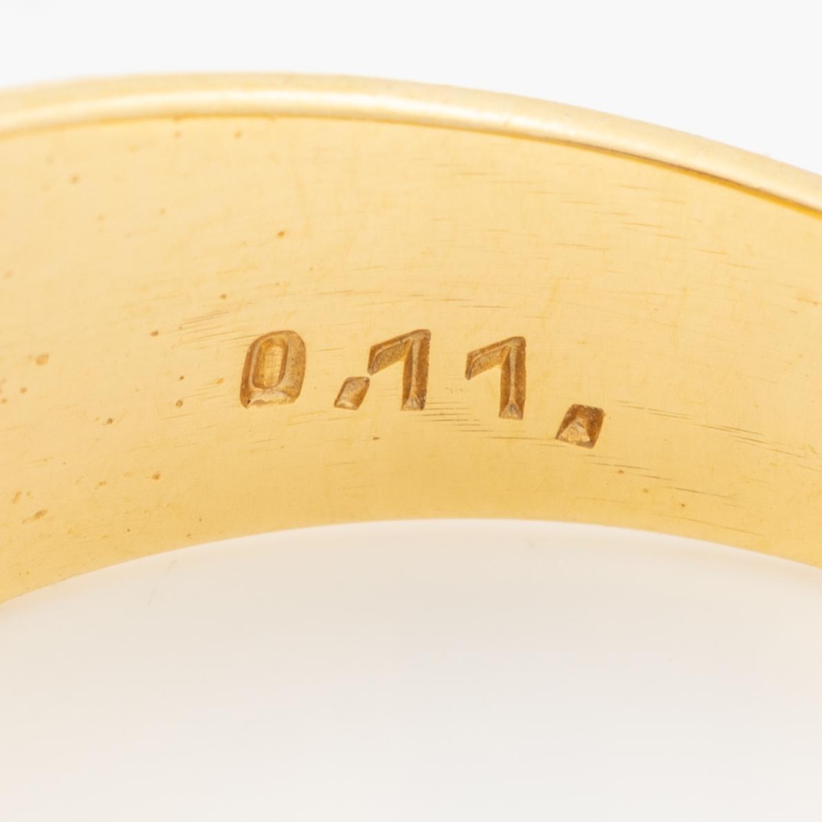Ring in 18K gold set with three brilliant-cut diamonds.