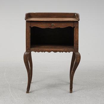 A mid 18th Century oak rococo bedside table.