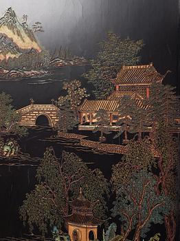 A set of four Chinese lacquer panels with wooden frames, early 20th century.