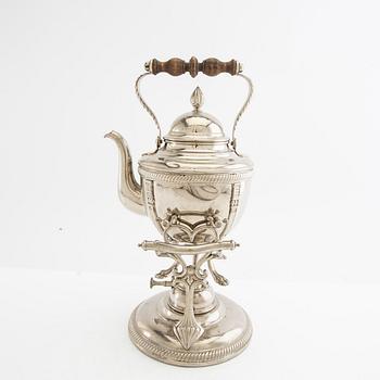 Tea kettle with a burner around 1900.