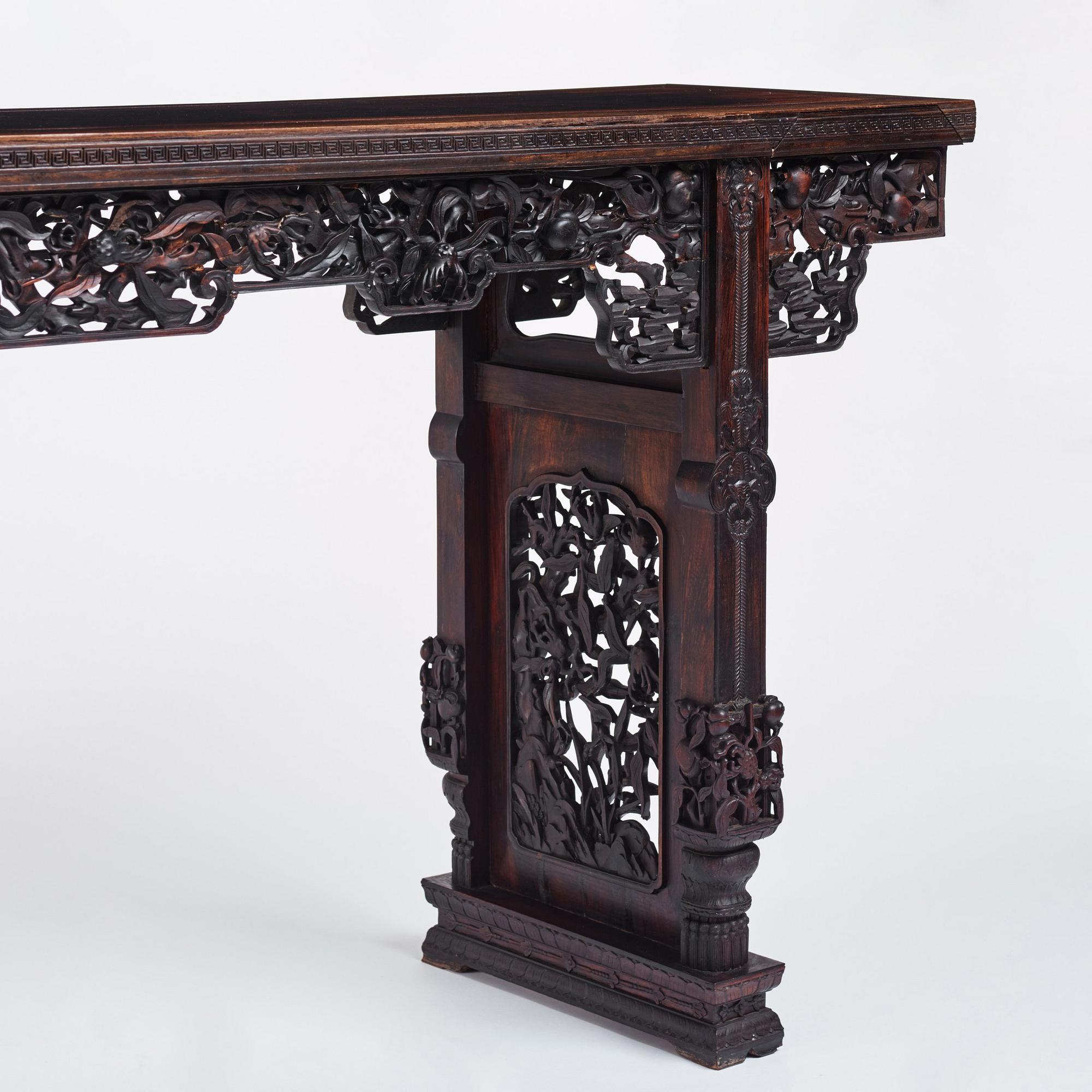 A massive zitan recessed-leg long table 'Jiaotousun Qiotouan', Qing dynasty, 19th century.