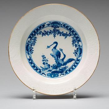 A set of eight blue and white armorial soup dishes, Qing dynasty, 18th Century.