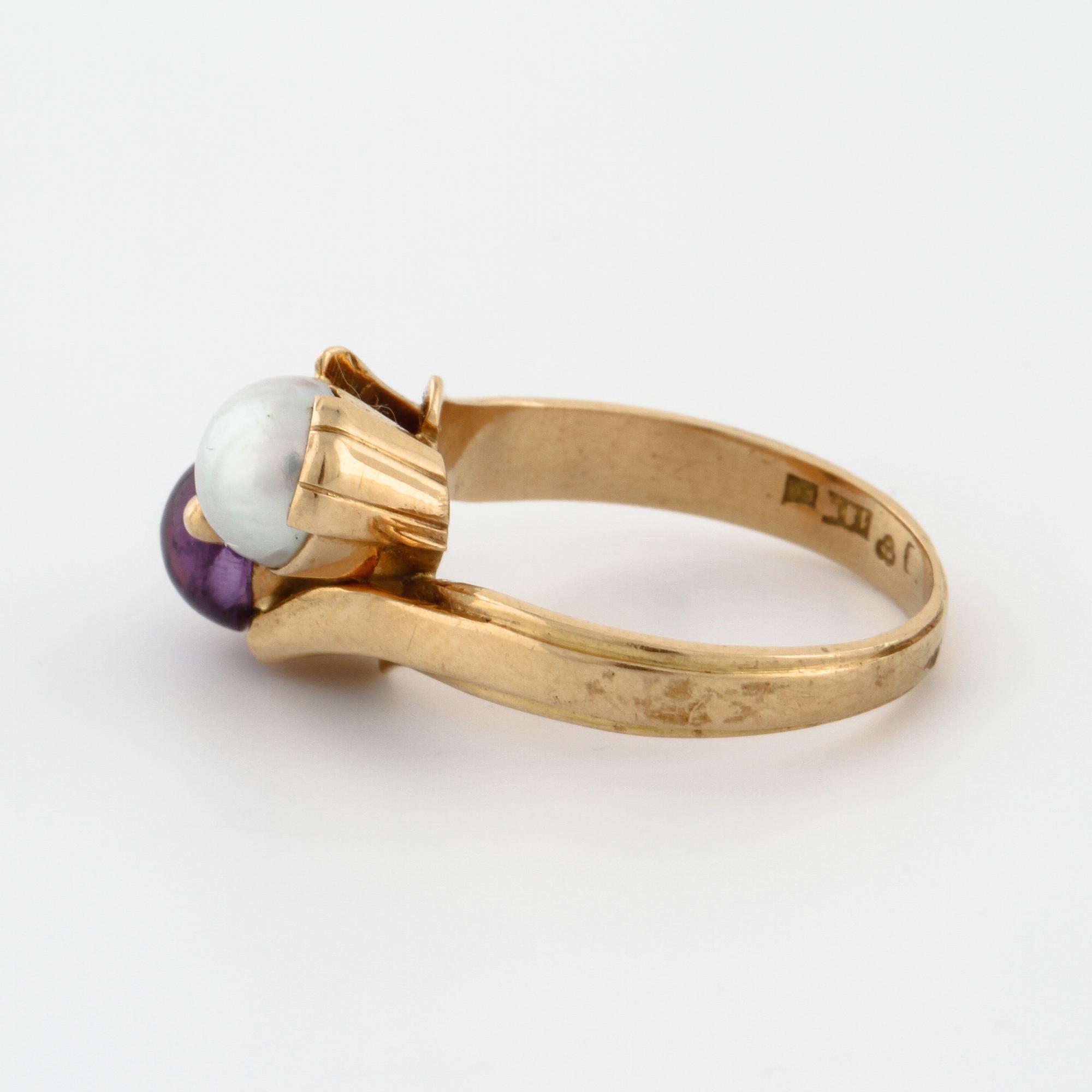A cultured pearl and cabochon cut amethyst ring by  Stigert, Stockholm, 1955.