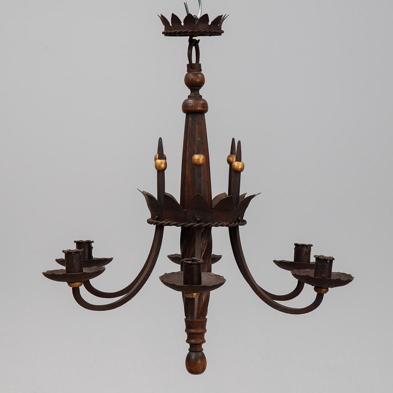 An iron and oak chandelier, 20th Century.