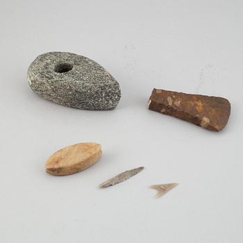 A collection of five neolithic objects.