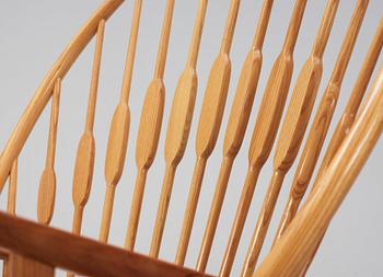 A Hans J Wegner ash and teak 'Peacock chair', Johannes Hansen, Denmark.