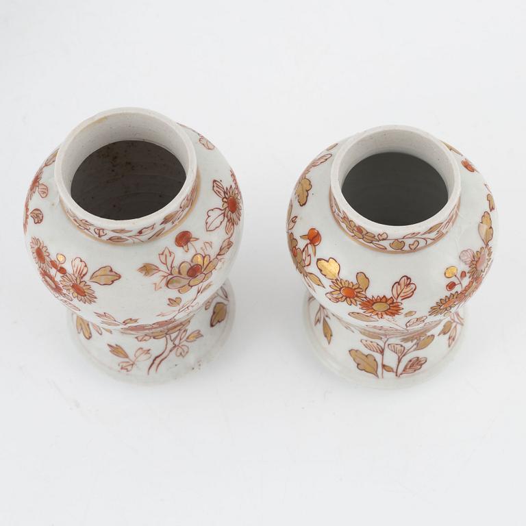 A pair of Kangxi urns, China, early 18th century, and a gourd-shaped vase, China, late 19th century.