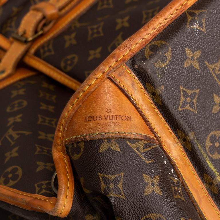 LOUIS VUITTON, a monogram canvas garment bag.