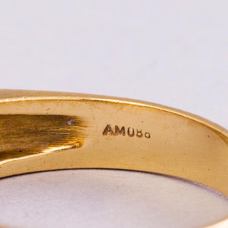 A 18K gold ring with 5 different stones: citrine, amethyst, topaz, garnet, peridot and a small diamond. Probably H.Stern.