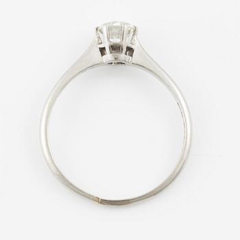 Platinum ring with brilliant-cut diamond.