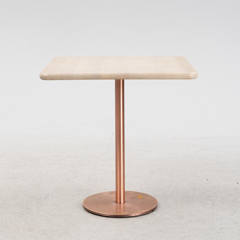 A steel and oak table by Jonas Lindvall 2011.