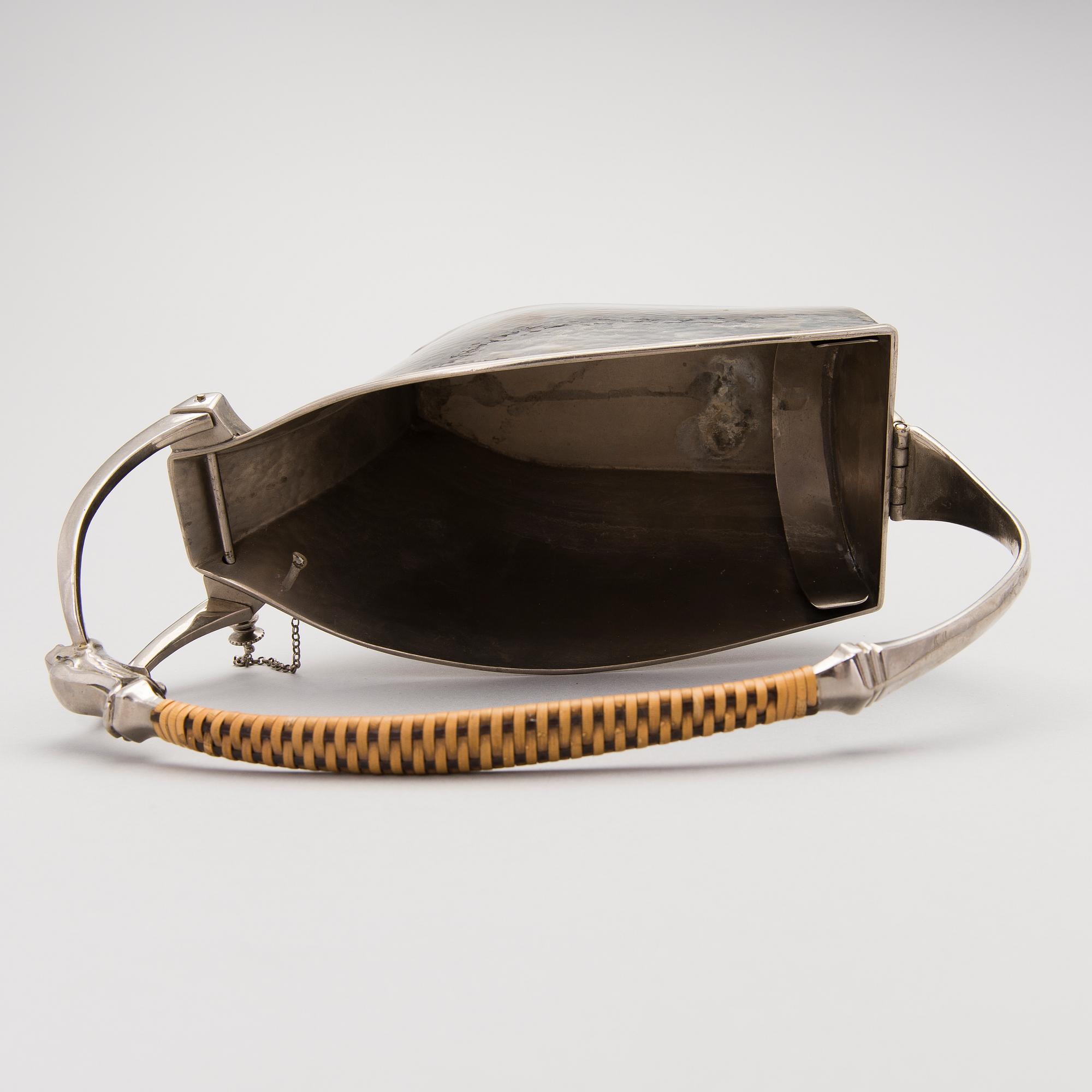 A metal wine bottle stand from WMF, Geislingen, Germany first half of the 20th Century.