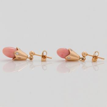 A pair of natural conchpearl and diamond earrings.