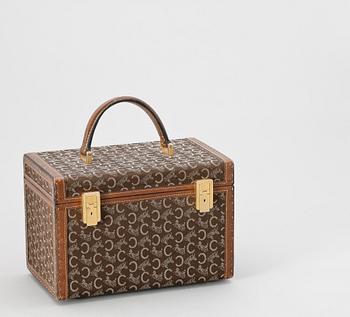 1334. A monogram canvas beautybox by Celine.