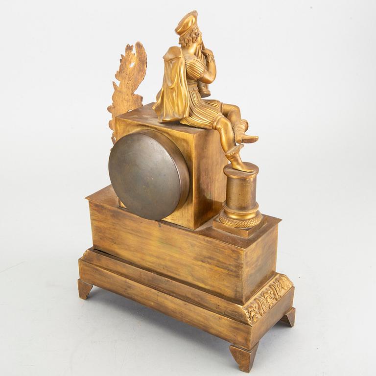 An 19th century empire mantel clock.
