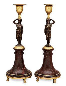 A pair of late Gustavian circa 1800 porphyry and bronze candlesticks.