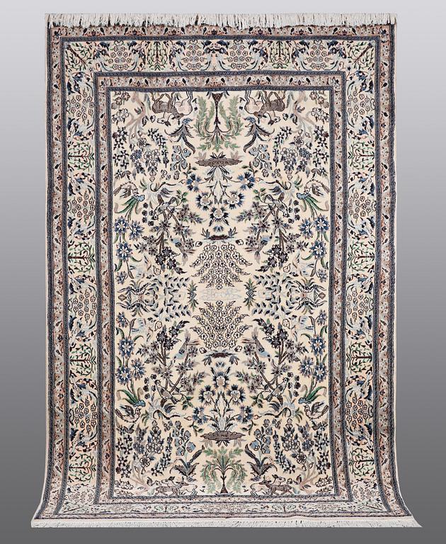 A CARPET, Nain, part silk, ca 302 x 192 cm.