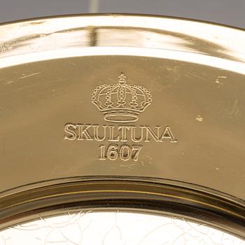 12 brass plates from Skultuna, late 20th century.