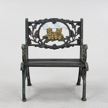 A children's cast iron garden sofa and armchair, mid 20th century.