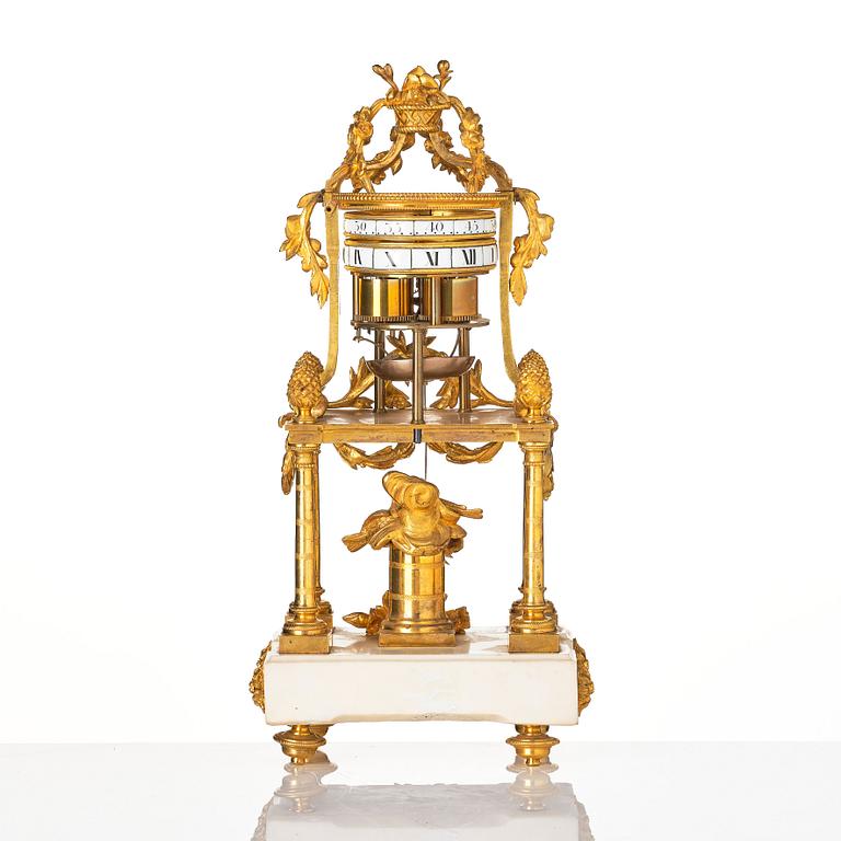 A Louis XVI marble and ormolu 'aux cercles tournants' portico mantel clock, late 18th century.