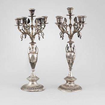 A pair of silver candelabras by Gustaf Möllenborg 1823-1850 (1930), Stockholm, 1875.