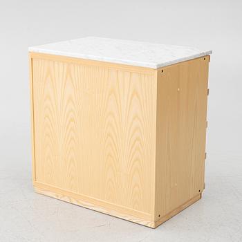 A contemporary chest of drawers.