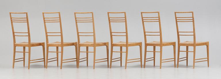 A set of six Erik Chambert 'Poem' birch and rattan dining chairs, Chambert's, Norrköping, Sweden, probably 1950's.