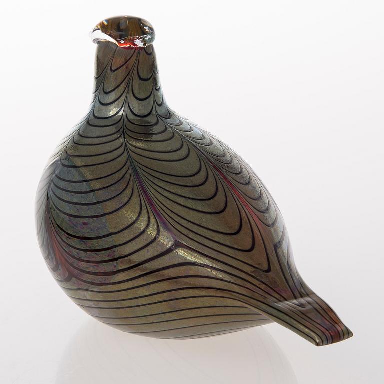 A glass bird, signed O. Toikka Nuutajärvi.