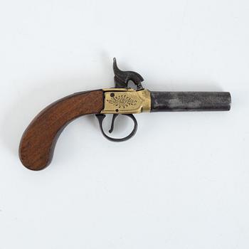 A 19th Century percussion pistol.