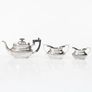 An English silver teapot, sugar bowl and cream jug, mark of Hammond, Creake & Co (Saint Arnaud Creake) Sheffield 1919.
