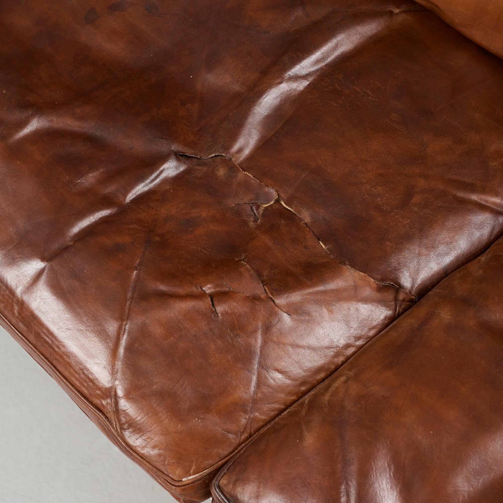 Poul Kjaerholm, a 'PK-31-4' four-seated brown leather and steel sofa, E Kold Christensen, Denmark 1960's.